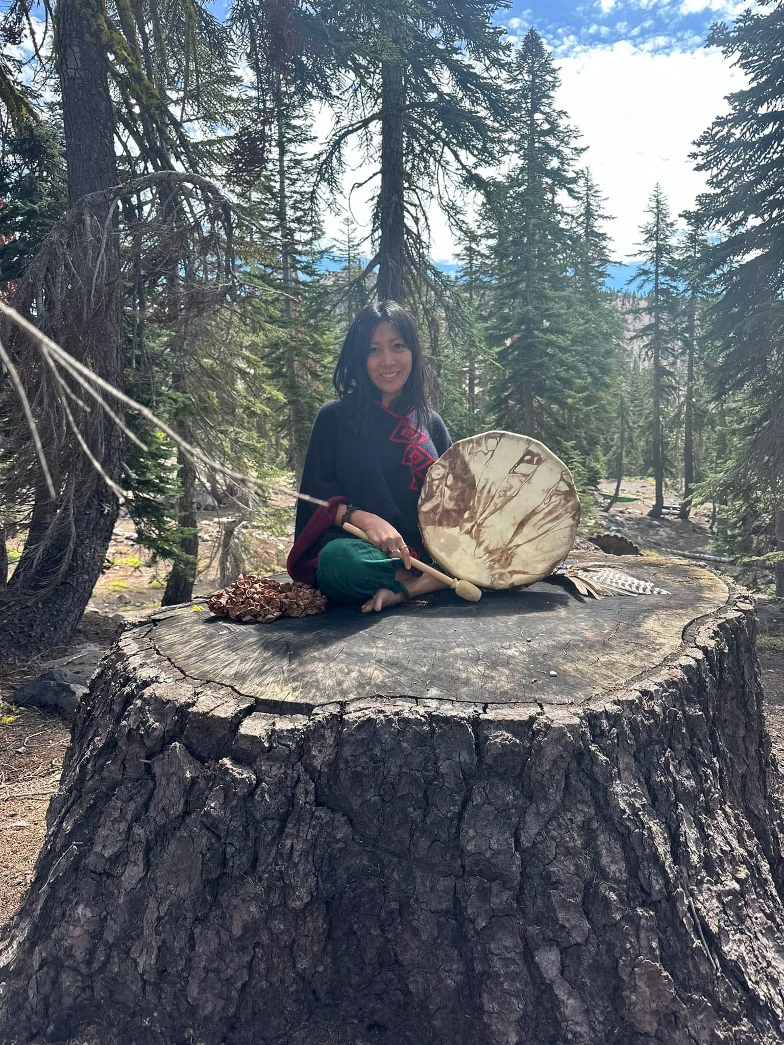 Master Kwasha with a frame drum in a forest